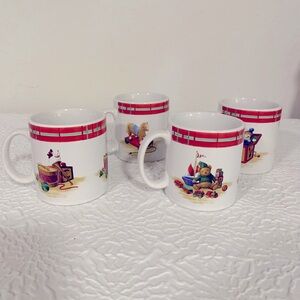 Four Vintage Oneida “Christmas Morning” coffee mugs.